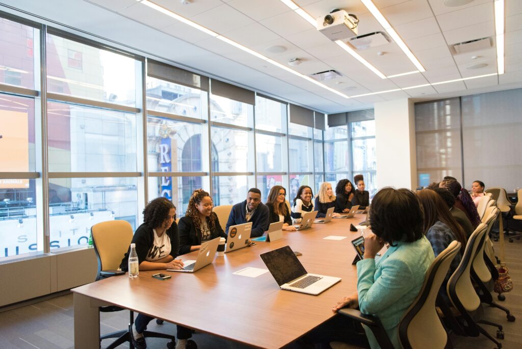 pexels photo 1181406 1181406 A diverse team of business professionals collaborating in a modern meeting room.